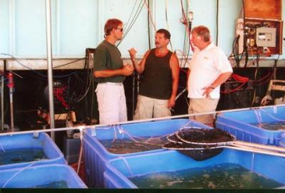 Fish care at the FFCBC - Centre Leo Korosec (organizer) talking to Darryl McLeod, MNR Biologist